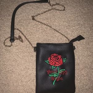 Black faux leather bag with chain and rose